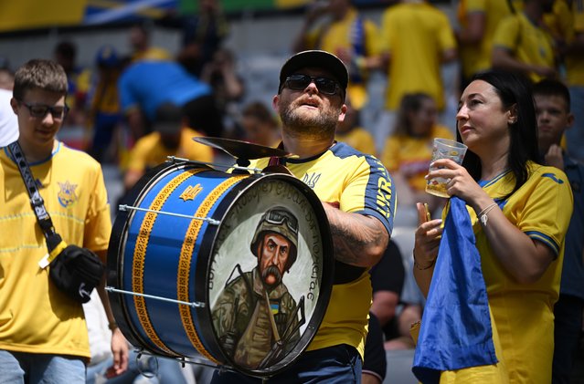 A fan of Ukraine, using a drum which features a painting of a Ukrainian Soldier, drums as he enjoys the pre match atmosphere prior to the UEFA EURO 2024 group stage match between Romania and Ukraine at Munich Football Arena on June 17, 2024 in Munich, Germany. (Photo by Clive Mason/Getty Images)