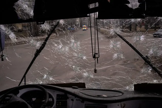 A machine-gunned bus where several people died in an ambush is photographed days after in the city of Kyiv, Ukraine, Friday, March 4, 2022. (Photo by Emilio Morenatti/AP Photo)