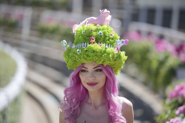 Julia Zelg poses for the photographers wearing a farm themed hat on the third day, of the Royal Ascot horse race meeting, traditional known as Ladies Day, at Ascot, England, Thursday, June 20, 2024. (Photo by Kin Cheung/AP Photo)
