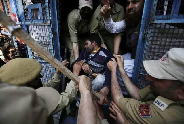Police detain a member of Jammu and Kashmir Handicapped Association (JKHA) during a protest march in Srinagar, the summer capital of Indian Kashmir, 10 May 2016. Police detained half a dozen members of JKHA, who were trying to reach the chief minister's office to hand over a memorandum highlighting their demands. They were demanding reservation in government and private jobs, 50 percent concession on electricity and water bills, 50 percent subsidy on loans, financial assistance of INR 6000 (around 80 euro) per month and conveyance facilities. (Photo by Farooq Khan/EPA)