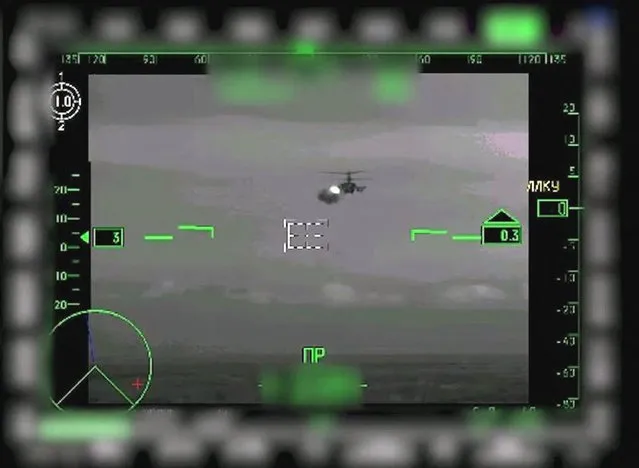 This video grab taken from a handout footage released by the Russian Defence Ministry on March 12, 2022 shows Russian KA-52 gunship helicopters striking a Ukrainian military object. (Photo by Russian Defence Ministry/AFP Photo)