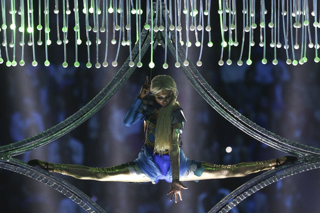 An acrobat performs during the opening ceremony at the Swimming World Championships in Kazan, Russia, Friday, July 24, 2015. (Photo by Denis Tyrin/AP Photo)