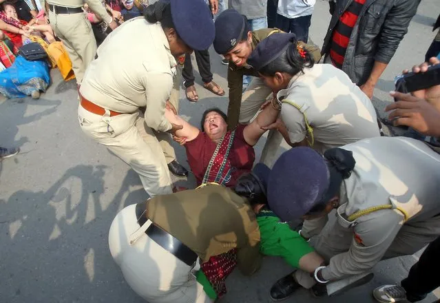 A demonstrator reacts as she is detained by police during a protest against the Citizenship Amendment Bill, a bill that seeks to give citizenship to religious minorities persecuted in neighbouring Muslim countries, in Agartala, December 10, 2019. (Photo by Jayanta Dey/Reuters)