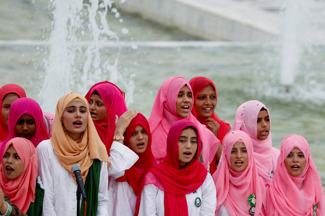 Attendees perform Pakistan's national anthem during Independence Day celebrations, at the mausoleum of Pakistan's founder, Mohammad Ali Jinnah, in Karachi, Pakistan on August 14, 2024. (Photo by Akhtar Soomro/Reuters)