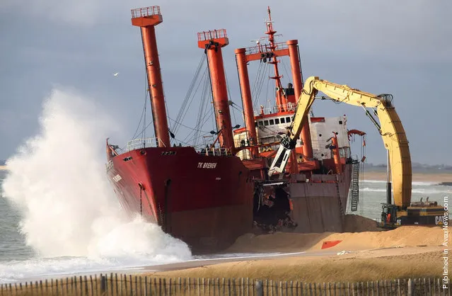 The beached TK Bremen is broken apart at Erdeven, France, on January 7, 2012