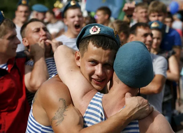 People gather during celebrations for the Paratroopers Day at the Central park in the Siberian city of Krasnoyarsk, Russia, August 2, 2015. (Photo by Ilya Naymushin/Reuters)