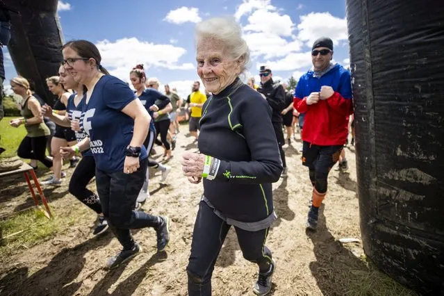 Mildred Wilson and her son Danny during Tough Mudder's Missouri 5K on May 1, 2022. Mildred Wilson, 83, is the oldest person ever to complete the brutal course.Tough Mudder is an endurance race filled with punishing obstacles such as a giant ice bath, a 60-foot watery trench under a steel fence, a dash through 10,000 volts of electricity and a 12-foot wooden ladder with giant rungs named the “Ladder to Hell”. (Photo by Tough Mudder/South West News Service)