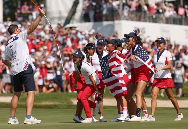 Team United States reacts after winning the Solheim Cup during the Sunday Singles matches during the final round of the Solheim Cup 2024 at Robert Trent Jones Golf Club on September 15, 2024 in Gainesville, Virginia. (Photo by Scott Taetsch/Getty Images/AFP Photo)