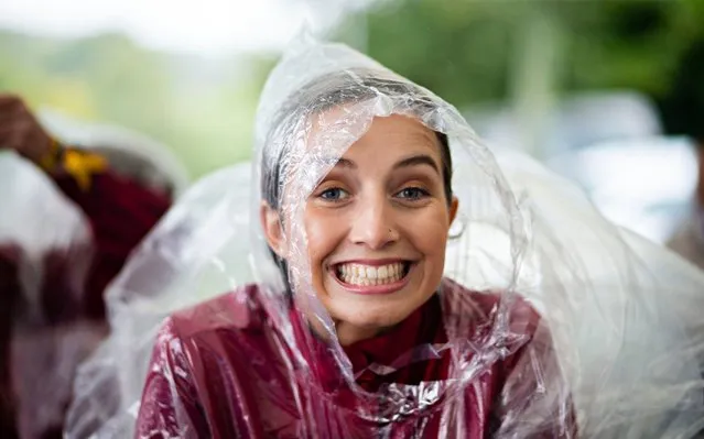 A Goodwood official prepares to brave the rain on the opening day of the Glourious Goodwood, racing festivall at Goodwood Racecourse, Chichester, England on July 30, 2019. (Photo by David Hartley/PA Wire Press Association)