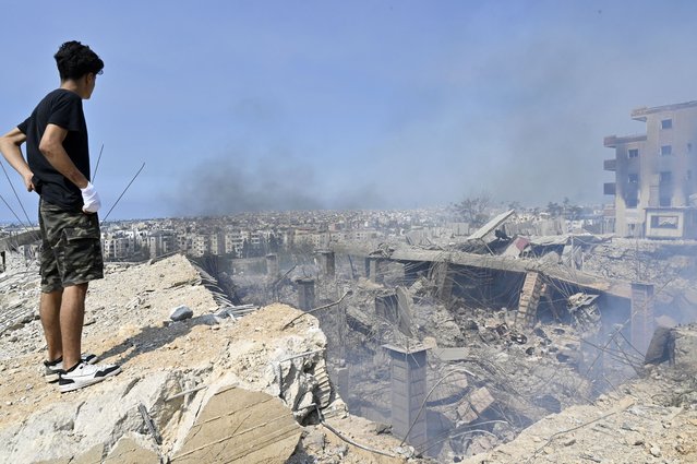 A man looks at a damaged building at the site of an Israeli airstrike in Choueifat, southeast of Beirut, Lebanon, 28 September 2024. The Israeli army (Tsahal) said on 28 September 2024 on X (formerly Twitter) that Hezbollah leader Hassan Nasrallah was killed in an overnight strike on Beirut. Hezbollah confirmed the death of Nasrallah in a statement on 28 September 2024. (Photo by Wael Hamzeh/EPA/EFE)