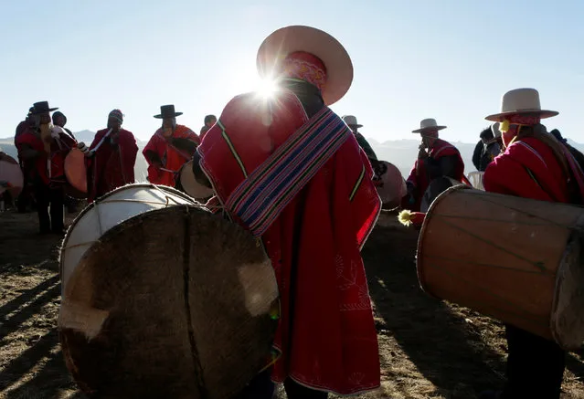 Bolivian indigenous musicians perform during Aymara New Year ceremony in El Alto near La Paz, Bolivia, June 21, 2016. (Photo by David Mercado/Reuters)