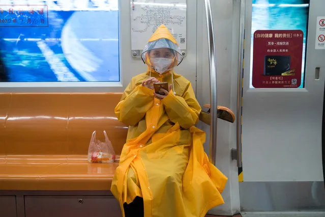 A woman wearing protective gear sits on the subway on February 10, 2020 in Beijing, China. February 10 marks the end of the Chinese New Year holidays, that were extended due to the outbreak of novel coronavirus, however, the Chinese capital remains empty and business does not seem to resume. (Photo by Andrea Verdelli/Getty Images)