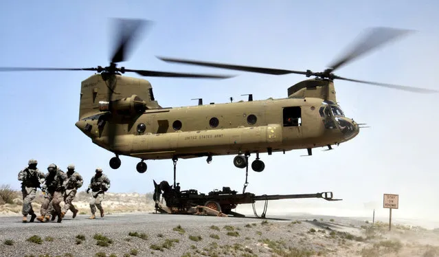 Number 5. BOEING CH-47 CHINOOK is a twin-engine, tandem rotor heavy-lift helicopter. Its primary roles are troop movement, artillery placement and battlefield resupply. It has a wide loading ramp at the rear of the fuselage and three external-cargo hooks. With a top speed of 170 knots (196 mph, 315 km/h) the helicopter is faster than contemporary 1960s utility and attack helicopters. (Photo by Spc. Jeanita C. Pisachubbe, HHC, Combat Aviation Brigade, 1st Armored Division)