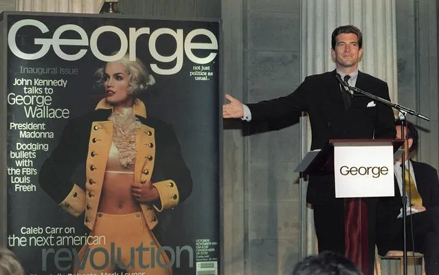 In this September 7, 1995 file photo, John F. Kennedy Jr., co-founder and editor-in-chief of the politics-as-lifestyle George magazine, unveils the magazine's first cover in New York. A documentary film on John Kennedy Jr.'s life opens Friday, July 22, 2016, in select theaters. It also airs on Spike TV at 9 p.m. EDT on Aug. 1, and a DVD release is set for Aug. 16. (Photo by Marty Lederhandler/AP Photo)