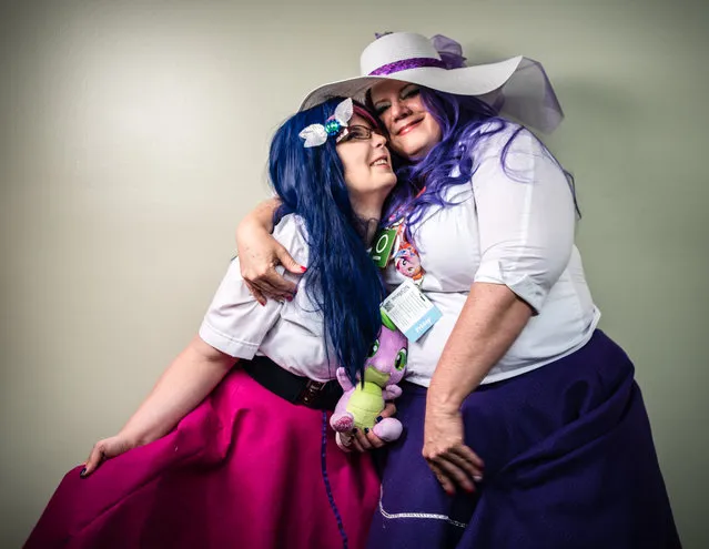 Terry Faith, right, and her daughter, Ellen Dennison, of Brunswick, MD, came to the convention as “Rarity” and “Twilight Sparkles”, respectively in Baltimore, MD on July 8, 2016. BronyCon is the world's largest My Pretty Pony convention. Featuring cosplay and fan events, the annual convention was held at the Baltimore Convention Center. (Photo by Andre Chung/The Washington Post)