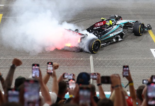 British Mercedes driver Lewis Hamilton in action to say goodbye to his team after the Abu Dhabi Grand Prix at the Yas Marina Circuit in Abu Dhabi, United Arab Emirates, 08 December 2024. (Photo by Ali Haider/EPA/EFE)