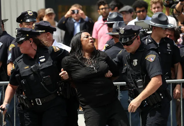 Cleveland police officers detain a protester in Cleveland Public Square near the site of the Republican National Convention on July 18, 2016 in Cleveland, Ohio. Protestors are staging demonstrations outside of the Republican National Convention which starts on Monday July 18 and runs through July 21. (Photo by Justin Sullivan/Getty Images)