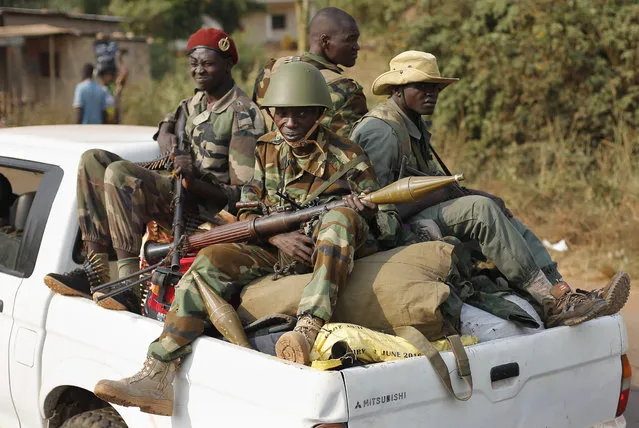 In this Monday January 27, 2014 photo, Seleka Muslim militias drive through Bangui, Central African Republic. A sweeping United Nations report has identified hundreds of human rights violations in Central African Republic that may amount to war crimes. The Tuesday may 30, 2017, report comes amid growing fears that the country terrorized by multiple armed groups is once again slipping into the sectarian bloodshed that left thousands dead between late 2013 and 2015. (Photo by Jerome Delay/AP Photo)