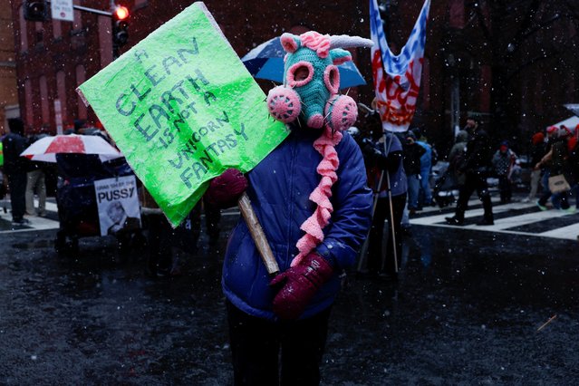 An anti-Trump protester demonstrates the day before U.S. President-elect Donald Trump is scheduled to be inaugurated for a second term, in Washington, U.S., January 19, 2025. (Photo by Shannon Stapleton/Reuters)