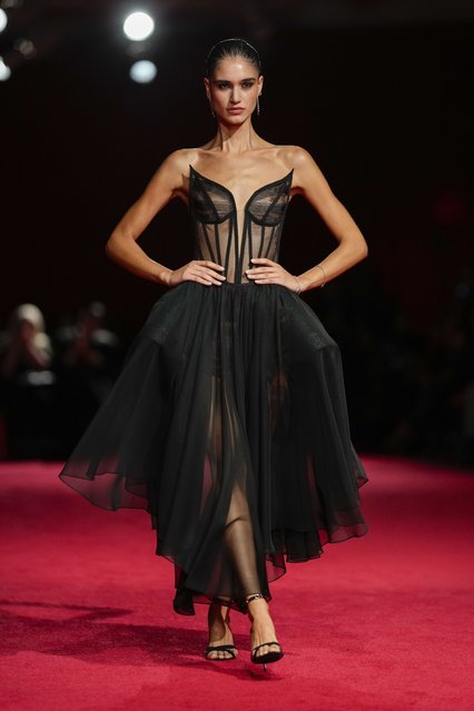 A model walks the runway during the Christian Siriano Fall/Winter 2025 fashion show at Chelsea Industrial during New York Fashion Week on Thursday, February 6, 2025, in New York. (Photo by Charles Sykes/Invision/AP Photo)