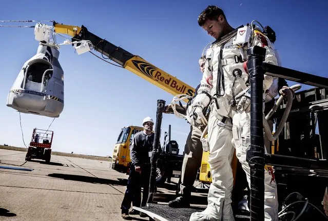 Baumgartner leaves the capsule after his mission was aborted. (Photo by Balazs Gardi/Red Bull Stratos)