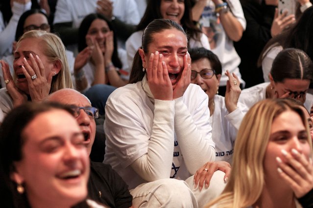 Dana Shem Tov (C) the sister of Israeli hostage Omer Shem Tov reacts as she watches with others his televised release by Hamas militants at thefamily home in Tel Aviv on February 22, 2025. Masked Hamas militants brought three more Israeli hostages on stage in central Gaza's Nuseirat area on February 22, before handing them over to the Red Cross, an AFP journalist reported. (Photo by John Wessels/AFP Photo)