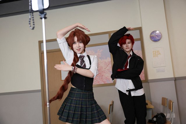 Visitors dance while wearing costumes at Chen Go, an “idol experience center” where fans dress up as K-Pop idols, in Shanghai, China, on April 5, 2025. (Photo by Go Nakamura/Reuters)