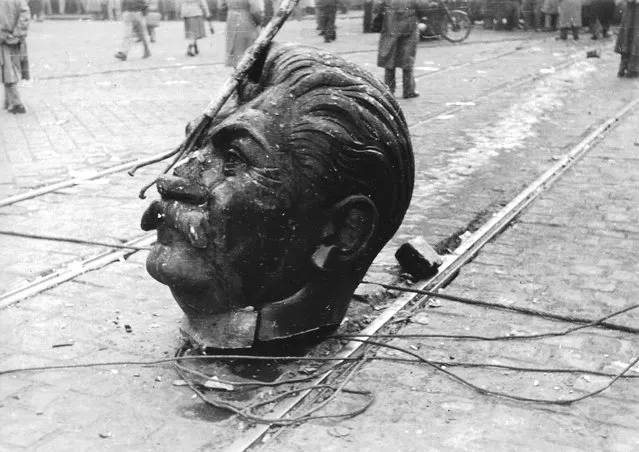 Josef Stalin's head is left in a Budapest street after a statue to the communist dictator was torn from its plinth during the Hungarian Revolution in 1956. (Photo by Robert Hofbauer/Radio Free Europe/Radio Liberty)