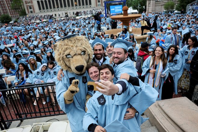 Students pose with a person dressed as Roar-ee the Lion mascot, on the day of Columbia University commencement ceremony on Columbia's main campus, in New York City on May 21, 2025. (Photo by Jeenah Moon/Reuters)