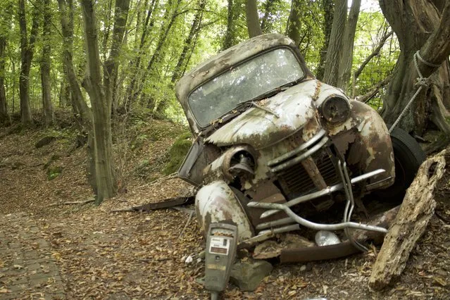 One of Michael's unnamed manufactured cars battered and broken into a tree in Neandertal Germany, September 11, 2016. (Photo by Christoph Hagen/Barcroft Images)