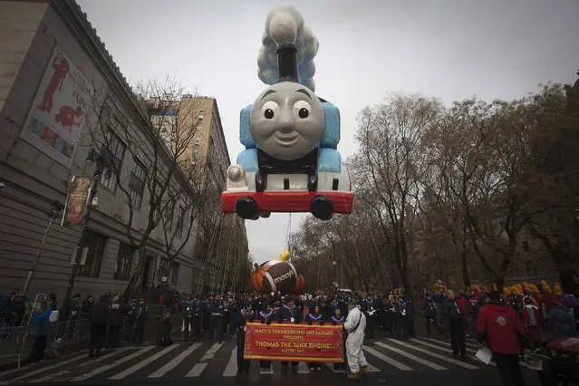 A Thomas the Tank Engine float before the Macy's Thanksgiving Day Parade in New York, November 27, 2014. (Photo by Carlo Allegri/Reuters)