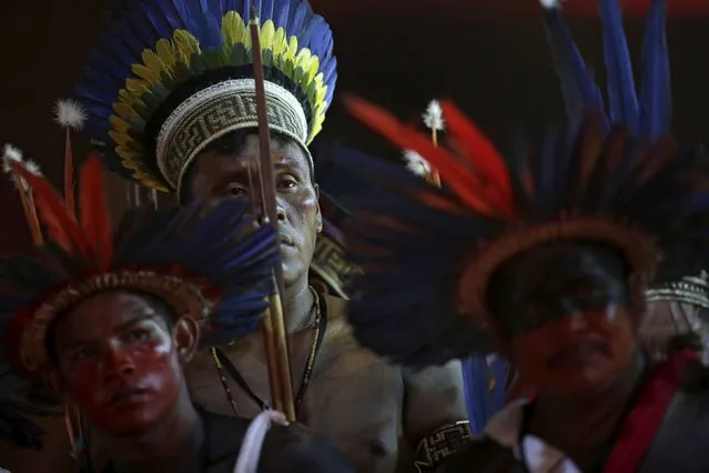 Indigenous people of several tribes watch a presentation by Indigenous people from Kuikuro before the I World Games for Indigenous People in Palmas, Brazil, October 21, 2015. (Photo by Ueslei Marcelino/Reuters)