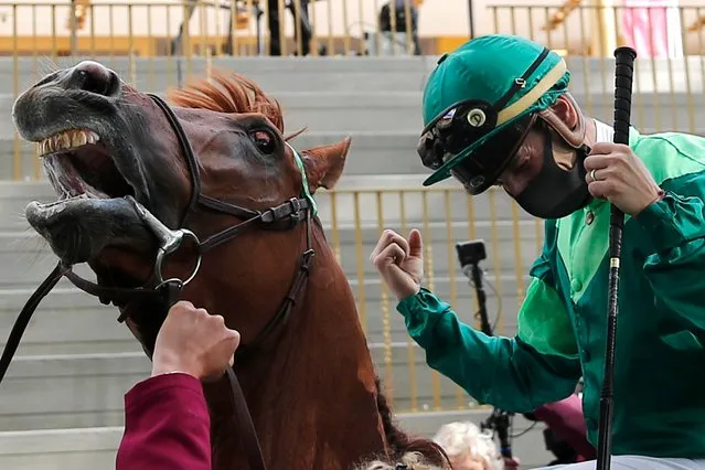 Jockey Cristian Demuro riding Sottsass celebrates after winning the Qatar Arc de Triomphe horse race at the Longchamp race track, outside Paris, Sunday October 4, 2020. (Photo by Francois Mori/AP Photo)