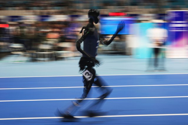 A robot competes in the 1500m event for the World Humanoid Robot Games held in Beijing, China, Friday, August 15, 2025. (Photo by Ng Han Guan/AP Photo)