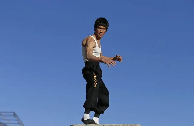 Abbas Alizada, who calls himself the Afghan Bruce Lee, poses for the media in Kabul December 9, 2014. (Photo by Mohammad Ismail/Reuters)