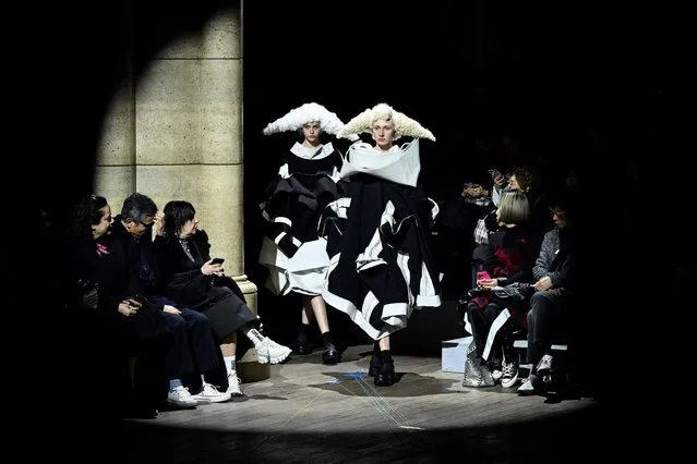 Models present creations from Comme des Garcons Womenswear Fall-Winter 2023-2024 collection during Paris Fashion Week in Paris, on March 4, 2023. (Photo by Emmanuel Dunand/AFP Photo)