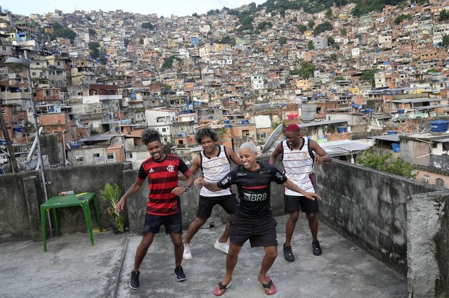 Youth perform a street dance style known as passinho for their social media accounts, in the Rocinha favela of Rio de Janeiro, Brazil, Wednesday, April 17, 2024. The passinho, or “little step”, created in the 2000s by kids in Rio’s favelas, was declared an “intangible cultural heritage” by state legislators, bringing recognition to a cultural expression born in the sprawling working-class neighborhoods. (Photo by Silvia Izquierdo/AP Photo)