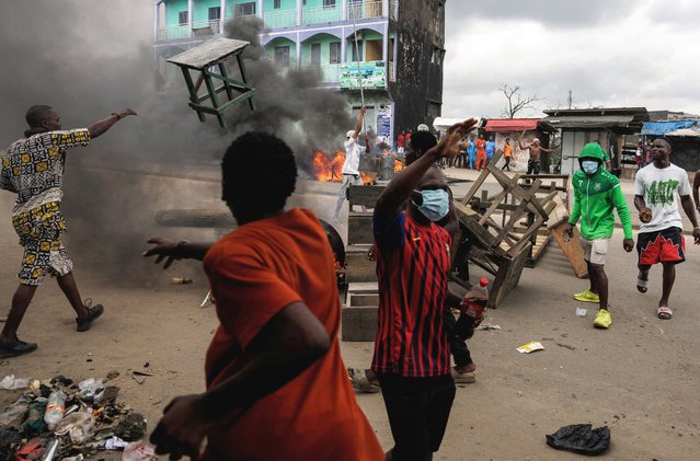 Supporters of the Cameroon opposition candidate Issa Tchiroma react as they clash with security forces during a protest after the Constitutional Council declared President Paul Biya the winner of the October 12 presidential election in Douala, Cameroon, on October 27, 2025. (Photo by Zohra Bensemra/Reuters)