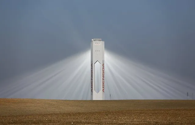 A tower of Abengoa solar plant at "Solucar" solar park is pictured in Sanlucar la Mayor, near the Andalusian capital of Seville, southern Spain November 13, 2015. (Photo by Marcelo del Pozo/Reuters)
