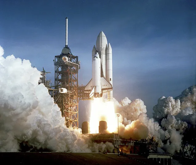 This 12 April, 1981, NASA photo shows the first launching of the space shuttle from the Kennedy Space Center in Florida. Columbia carried astronauts John Young and Robert Crippen. The space center is 600 miles (965kms) south of Kitty Hawk, North Carolina, where the Wright Brothers first flew under power. (Photo by AFP Photo/NASA)