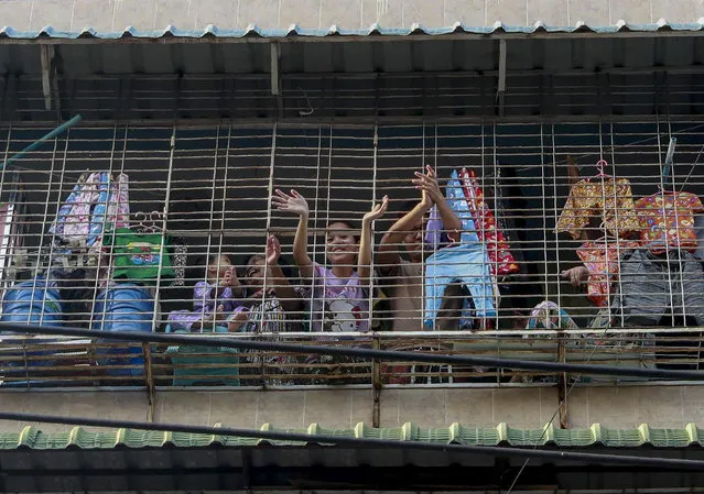 People clap to make noise as they participate in a civil disobedience action to protest against the military coup in Yangon, Myanmar, Tuesday, February 4, 2021. (Photo by AP Photo/Stringer)