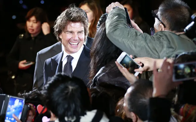 Actor Tom Cruise smiles at fans upon arrival for the Japan premiere of his latest film “Jack Reacher: Never Go Back” in Tokyo, Wednesday, Nov. 9, 2016. (Photo by Shizuo Kambayashi/AP Photo)
