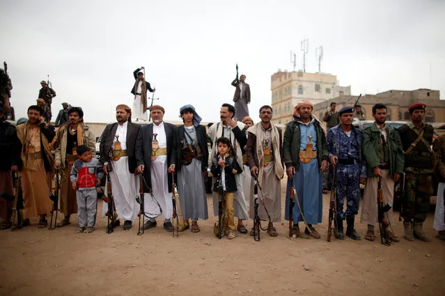 Tribesmen hold their weapons as they attend a tribal gathering to show support to the Houthi movement in Sanaa, Yemen November 10, 2016. (Photo by Khaled Abdullah/Reuters)