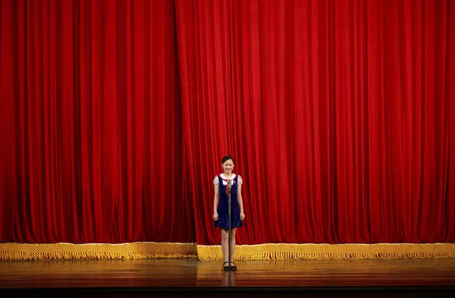 A girl performs on stage at Mangyongdae Children's Palace in Pyongyang, North Korea, Thursday, July 26, 2018. (Photo by Dita Alangkara/AP Photo)