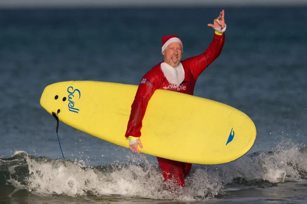 Surfing Santa's at Fistral Bay