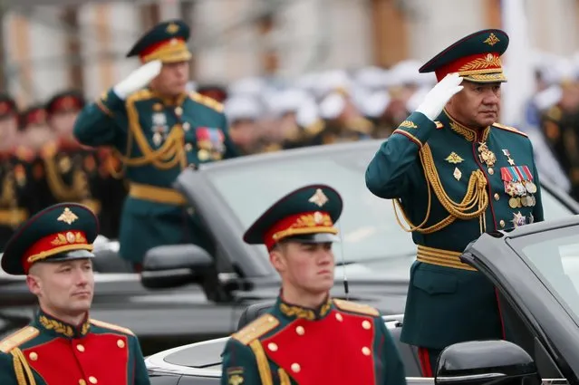 Russian Defence Minister Sergei Shoigu drives an Aurus cabriolet during a military parade on Victory Day, which marks the 76th anniversary of the victory over Nazi Germany in World War Two, in Red Square in central Moscow, Russia on May 9, 2021. (Photo by Evgenia Novozhenina/Reuters)