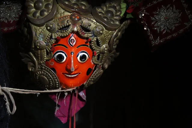 In this October 16, 2018, photo, masks used for dances in Indra Jatra Festival are hung in a room at Bhaktapur, Nepal. (Photo by Niranjan Shrestha/AP Photo)
