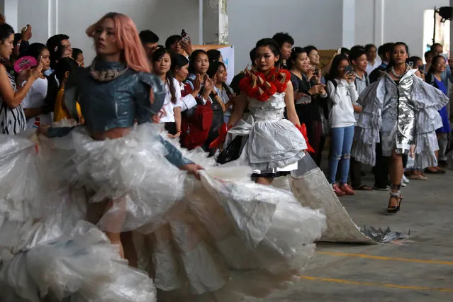 Models wear clothes made out of recycled materials during a show organised by LGBT fashion designers to battles discrimination in Phnom Penh, Cambodia, October 24, 2018. (Photo by Samrang Pring/Reuters)
