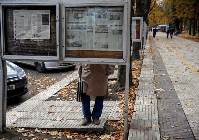 MOLDOVA: A man reads morning papers in Chisinau, Moldova, October 31, 2016. (Photo by Gleb Garanich/Reuters)