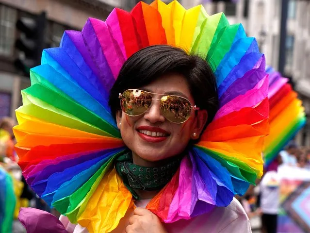 Members of the Lesbian, Gay, Bisеxual and Transgender (LGBT+) community take part in the annual Pride Parade in the streets of Soho in London on July 2, 2022. (Photo by Niklas Halle'n/AFP Photo)